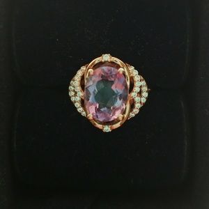 A rose gold ring with an amethyst stone